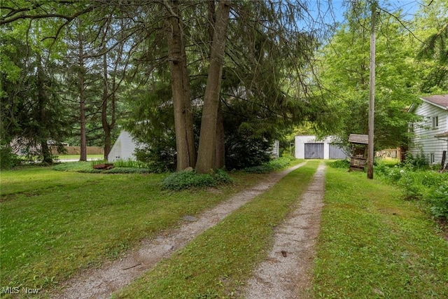 7100 Barton Rd, North Olmsted, OH 44070 - view of grassy yard with dirt driveway