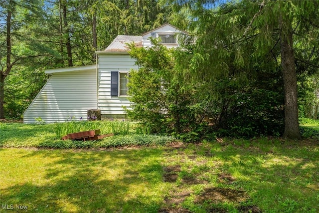 7100 Barton Rd, North Olmsted, OH 44070 - view of side of home with a yard