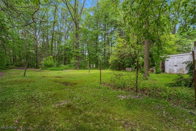 7100 Barton Rd, North Olmsted, OH 44070 - view of green lawn with a shed