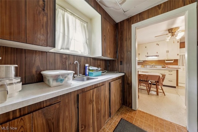 7100 Barton Rd, North Olmsted, OH 44070 - bar area with a sink, wood walls, ceiling fan, and light floors