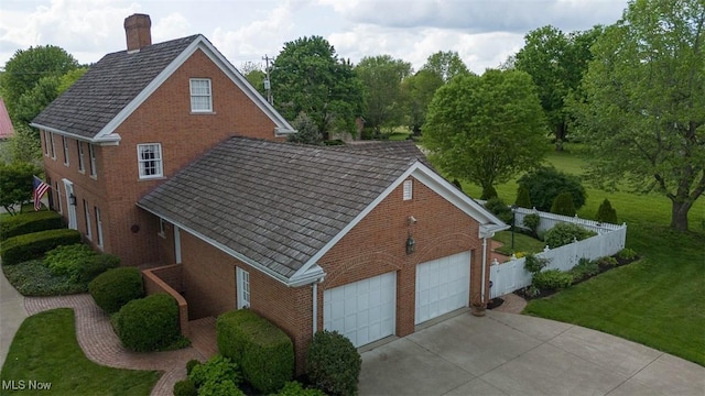 195 W 5th St, Zoar, OH 44622 - view of property exterior featuring brick siding and a chimney