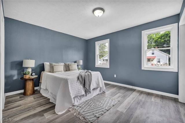 225 E Bergey St, Wadsworth, OH 44281 - bedroom with wood finished floors and baseboards