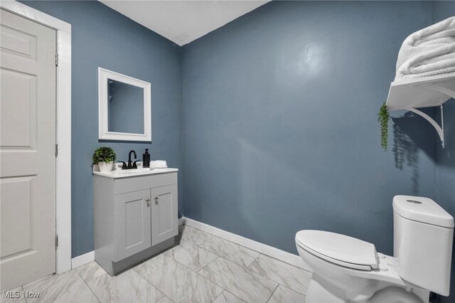 225 E Bergey St, Wadsworth, OH 44281 - bathroom with marble look tiles and vanity
