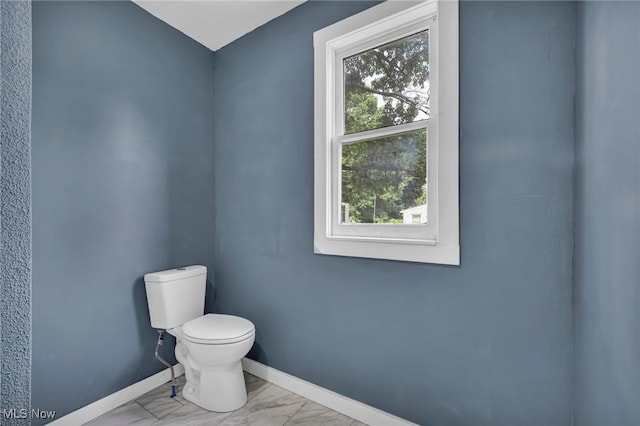 225 E Bergey St, Wadsworth, OH 44281 - half bath featuring toilet and marble look tiles