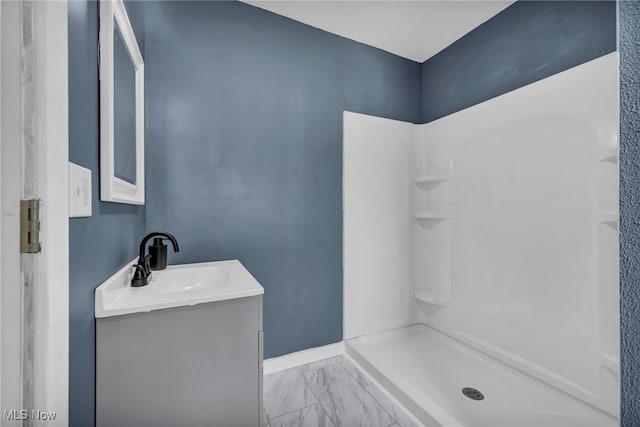 225 E Bergey St, Wadsworth, OH 44281 - full bath with vanity, a shower stall, and marble look tiles