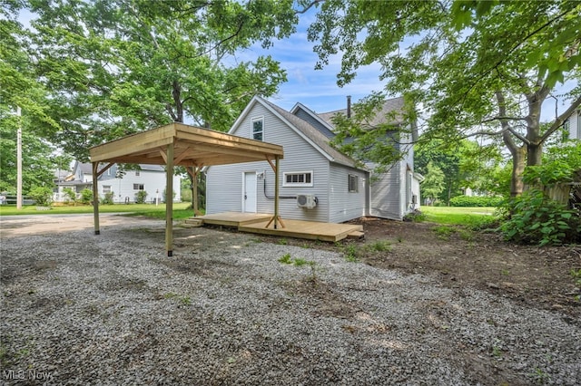 225 E Bergey St, Wadsworth, OH 44281 - view of front of property featuring a deck, a carport, and roof with shingles