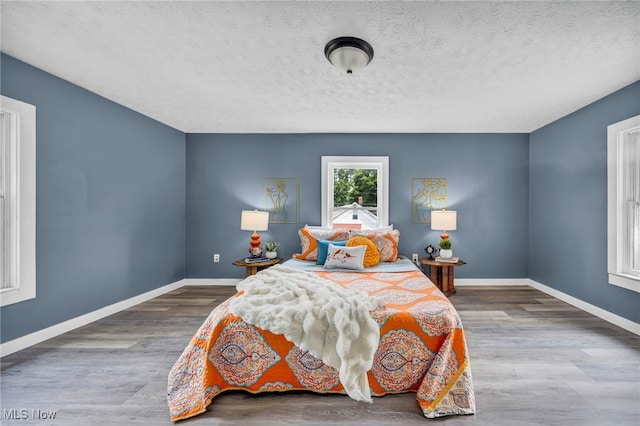225 E Bergey St, Wadsworth, OH 44281 - bedroom featuring wood finished floors and a textured ceiling