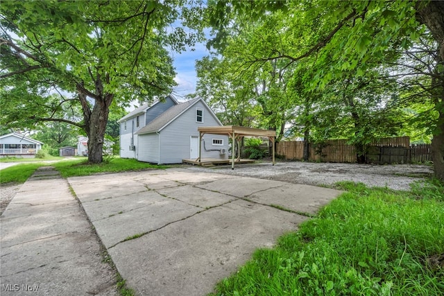 225 E Bergey St, Wadsworth, OH 44281 - view of side of property with driveway and a detached carport