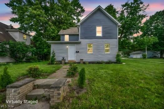225 E Bergey St, Wadsworth, OH 44281 - back of house at dusk with a yard