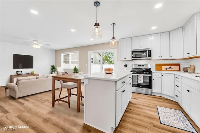 1255 E 351st St, Eastlake, OH 44095 - kitchen featuring stainless steel appliances, light wood-type flooring, a ceiling fan, light countertops, and recessed lighting