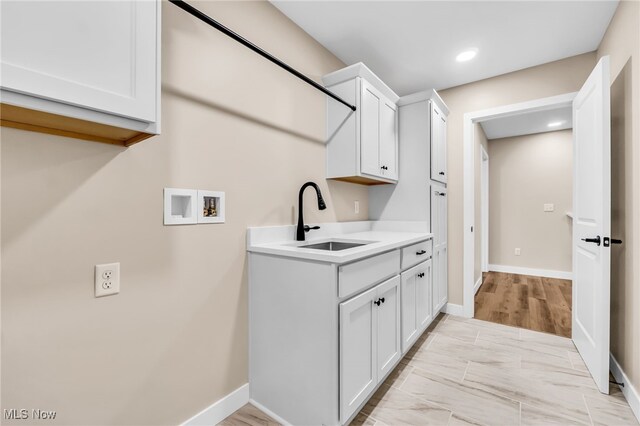 1255 E 351st St, Eastlake, OH 44095 - laundry area featuring washer hookup, cabinet space, baseboards, and recessed lighting