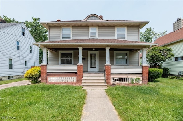 1222 W 6th St, Lorain, OH 44052 - american foursquare style home with a porch and a front yard
