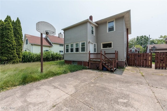 1222 W 6th St, Lorain, OH 44052 - back of house with a chimney