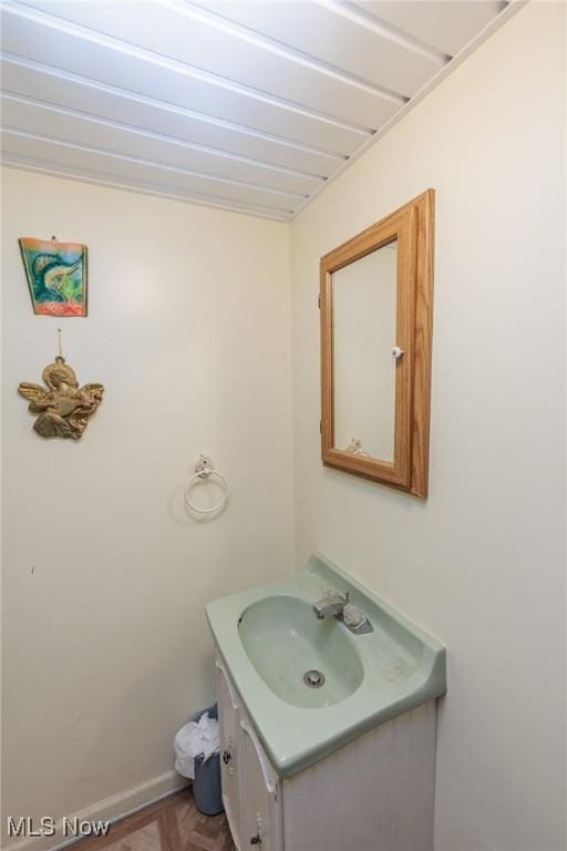 1222 W 6th St, Lorain, OH 44052 - bathroom featuring vanity and baseboards