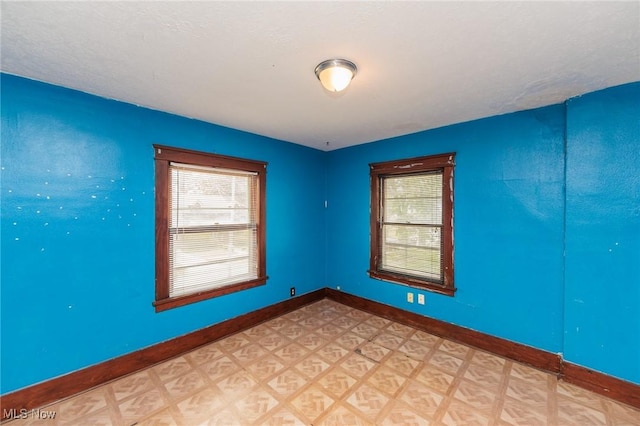 1222 W 6th St, Lorain, OH 44052 - unfurnished room featuring light flooring and baseboards