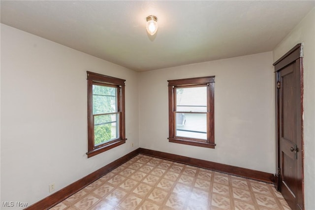 1222 W 6th St, Lorain, OH 44052 - spare room featuring light flooring and baseboards