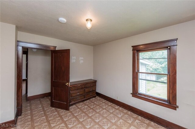 1222 W 6th St, Lorain, OH 44052 - bedroom featuring baseboards and light floors
