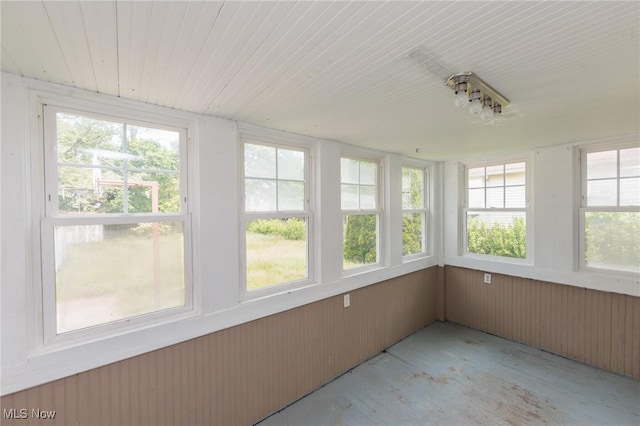 1222 W 6th St, Lorain, OH 44052 - unfurnished sunroom with healthy amount of natural light, wood ceiling, and wooden walls