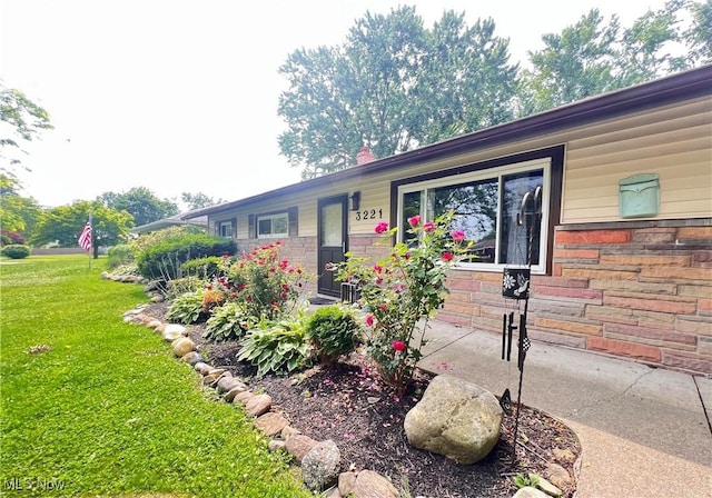 3221 Greenfield St NW, Warren, OH 44485 - view of front of property featuring a front lawn and stone siding