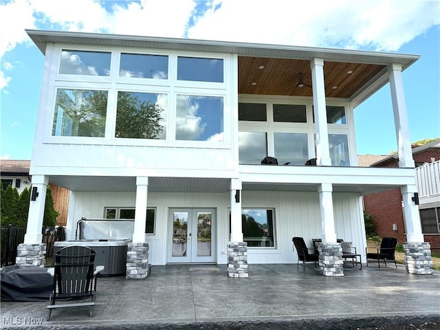 5771 E Blvd NW, Canton, OH 44718 - rear view of property featuring a patio area, french doors, and a hot tub
