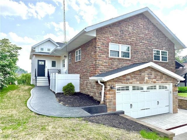 5771 E Blvd NW, Canton, OH 44718 - view of front of property featuring stone siding and a garage