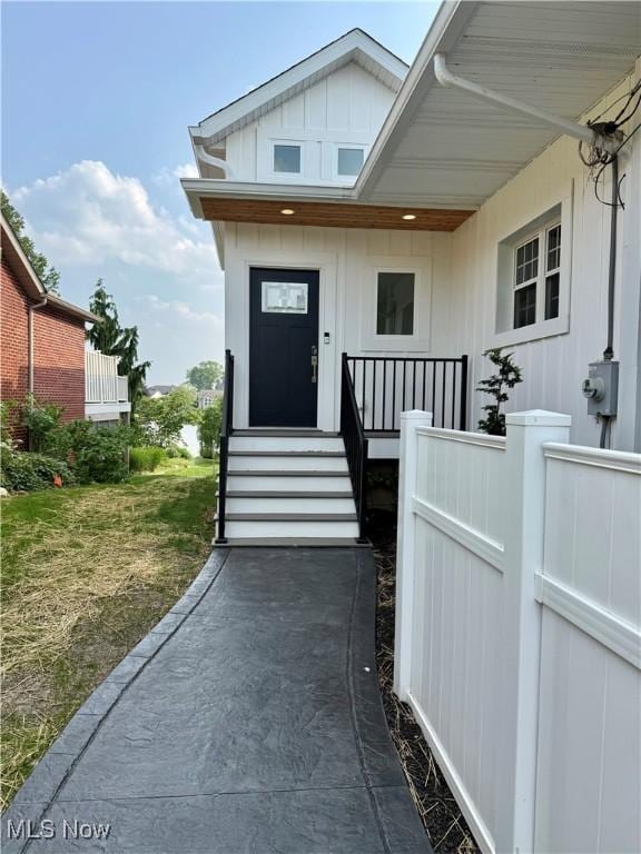 5771 E Blvd NW, Canton, OH 44718 - property entrance featuring board and batten siding
