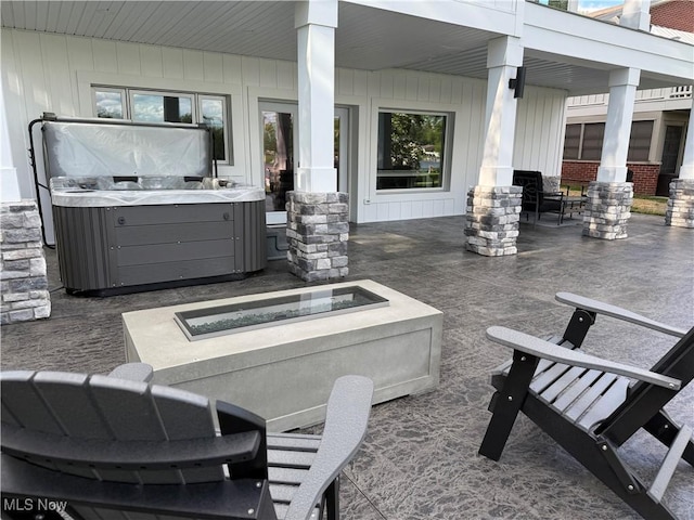 5771 E Blvd NW, Canton, OH 44718 - view of patio / terrace with a hot tub and a fire pit