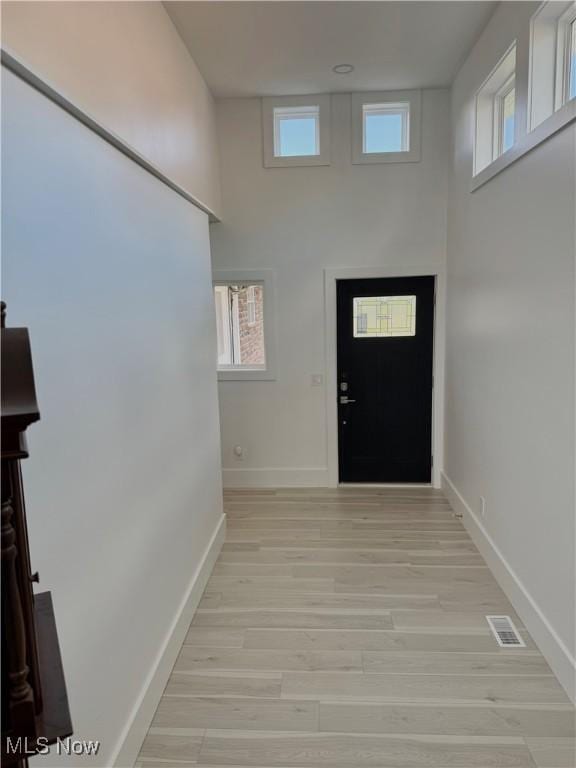 5771 E Blvd NW, Canton, OH 44718 - foyer entrance featuring light wood finished floors and a towering ceiling