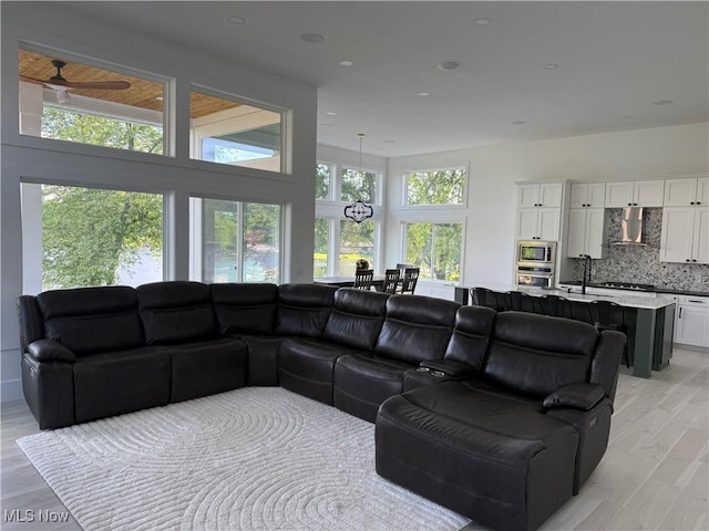 5771 E Blvd NW, Canton, OH 44718 - living area featuring a ceiling fan, light wood-type flooring, and recessed lighting