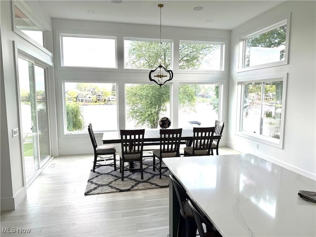5771 E Blvd NW, Canton, OH 44718 - dining area featuring healthy amount of natural light, a high ceiling, and light wood-type flooring
