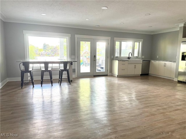 5771 E Blvd NW, Canton, OH 44718 - dining space with crown molding, french doors, wood finished floors, a textured ceiling, and recessed lighting