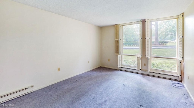 2385 Covington Rd Unit 102, Akron, OH 44313 - carpeted spare room featuring a baseboard radiator, baseboards, and a textured ceiling