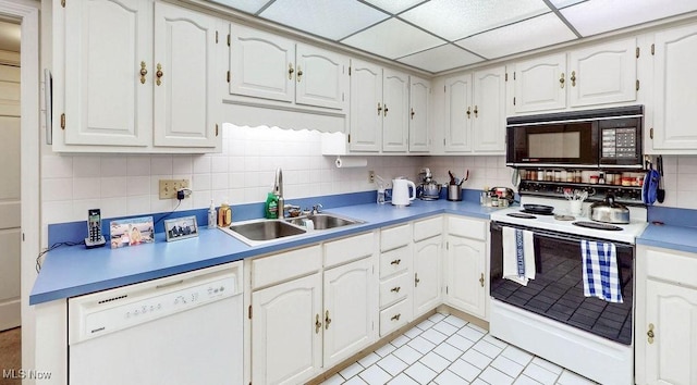 2385 Covington Rd Unit 102, Akron, OH 44313 - kitchen featuring white appliances, tasteful backsplash, a sink, and white cabinetry
