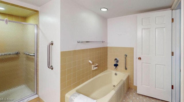 2385 Covington Rd Unit 102, Akron, OH 44313 - bathroom featuring tile patterned flooring, a stall shower, a bath, and recessed lighting