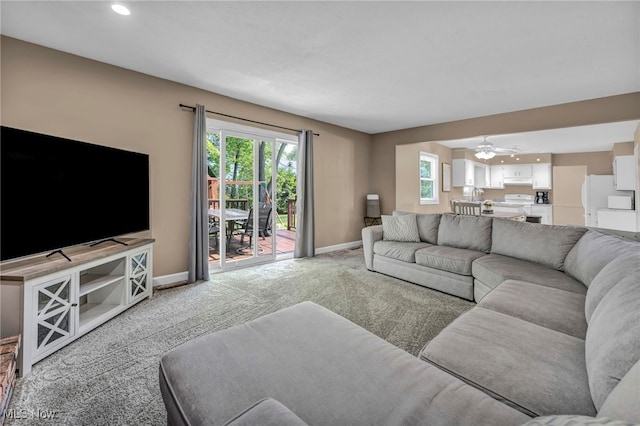 3895 Mars Dr, Brunswick, OH 44212 - living area with light colored carpet, baseboards, recessed lighting, and ceiling fan