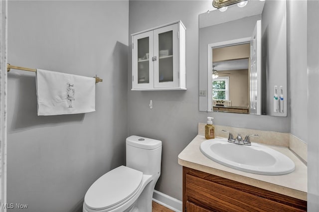 3895 Mars Dr, Brunswick, OH 44212 - bathroom featuring vanity, toilet, and a ceiling fan