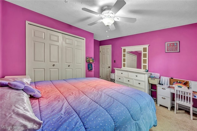 3895 Mars Dr, Brunswick, OH 44212 - carpeted bedroom featuring a closet, a textured ceiling, and ceiling fan