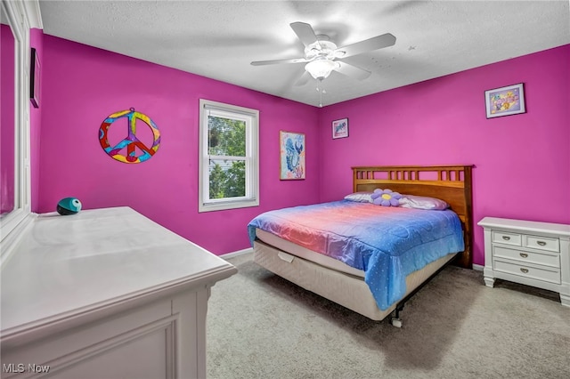 3895 Mars Dr, Brunswick, OH 44212 - bedroom with carpet flooring, baseboards, ceiling fan, and a textured ceiling