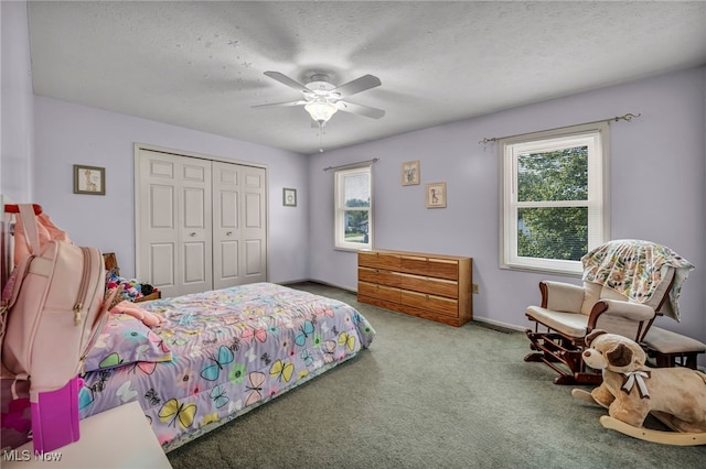 3895 Mars Dr, Brunswick, OH 44212 - carpeted bedroom with a closet, ceiling fan, baseboards, and a textured ceiling