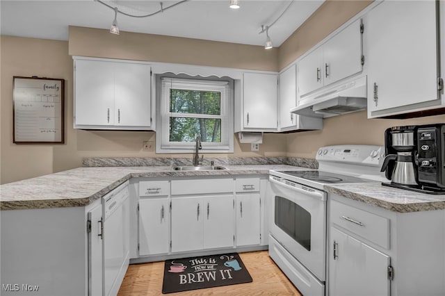 3895 Mars Dr, Brunswick, OH 44212 - kitchen featuring under cabinet range hood, white appliances, a sink, and white cabinetry