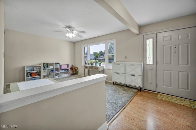 3895 Mars Dr, Brunswick, OH 44212 - foyer featuring light wood-style floors, a ceiling fan, and beam ceiling