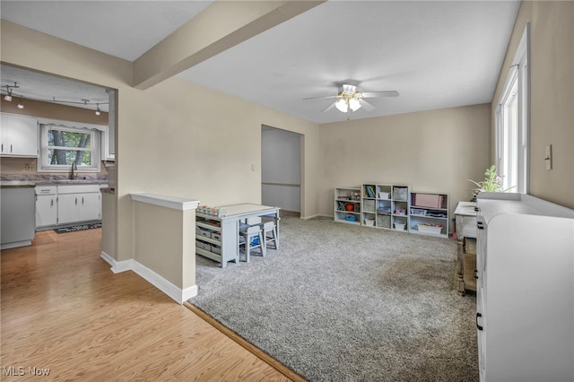 3895 Mars Dr, Brunswick, OH 44212 - game room featuring ceiling fan, baseboards, light wood-style floors, and a sink