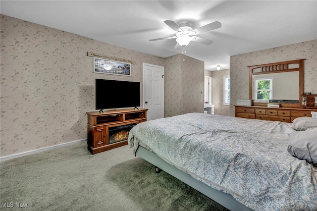 3895 Mars Dr, Brunswick, OH 44212 - bedroom featuring wallpapered walls, carpet flooring, a ceiling fan, and baseboards