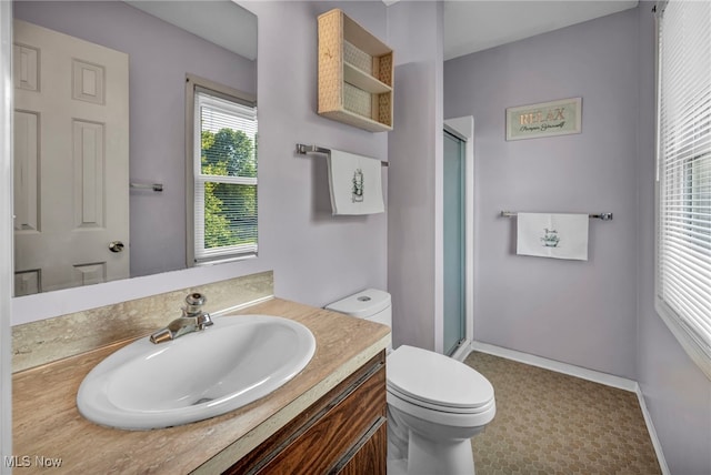 3895 Mars Dr, Brunswick, OH 44212 - full bath with toilet, vanity, a shower stall, and baseboards