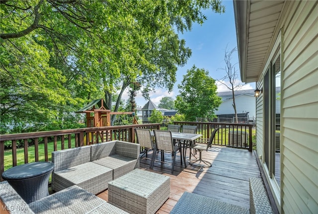 3895 Mars Dr, Brunswick, OH 44212 - wooden terrace featuring outdoor dining space, a playground, and outdoor lounge area