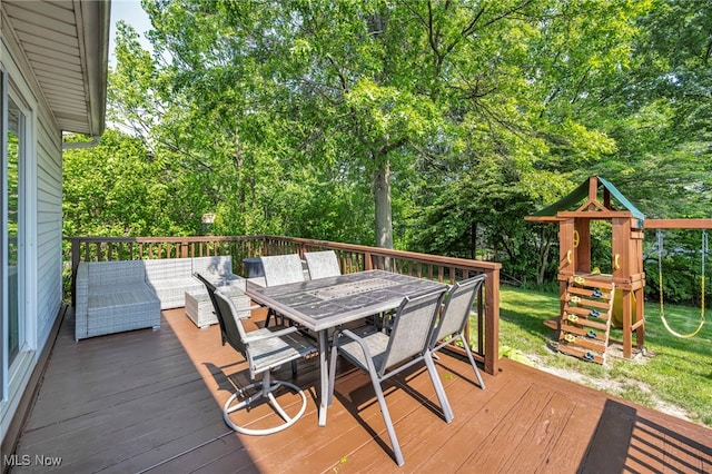 3895 Mars Dr, Brunswick, OH 44212 - wooden deck featuring outdoor dining space, a playground, and view of wooded area