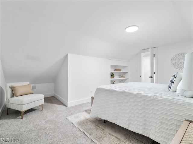 2295 Thurman Ave, Cleveland, OH 44113 - carpeted bedroom featuring vaulted ceiling and baseboards