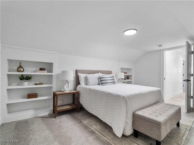 2295 Thurman Ave, Cleveland, OH 44113 - carpeted bedroom with lofted ceiling and baseboards