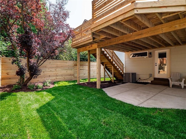 2295 Thurman Ave, Cleveland, OH 44113 - view of yard with stairs, central AC, and a patio