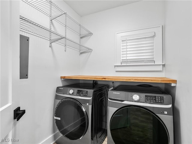 2295 Thurman Ave, Cleveland, OH 44113 - laundry area featuring independent washer and dryer and baseboards